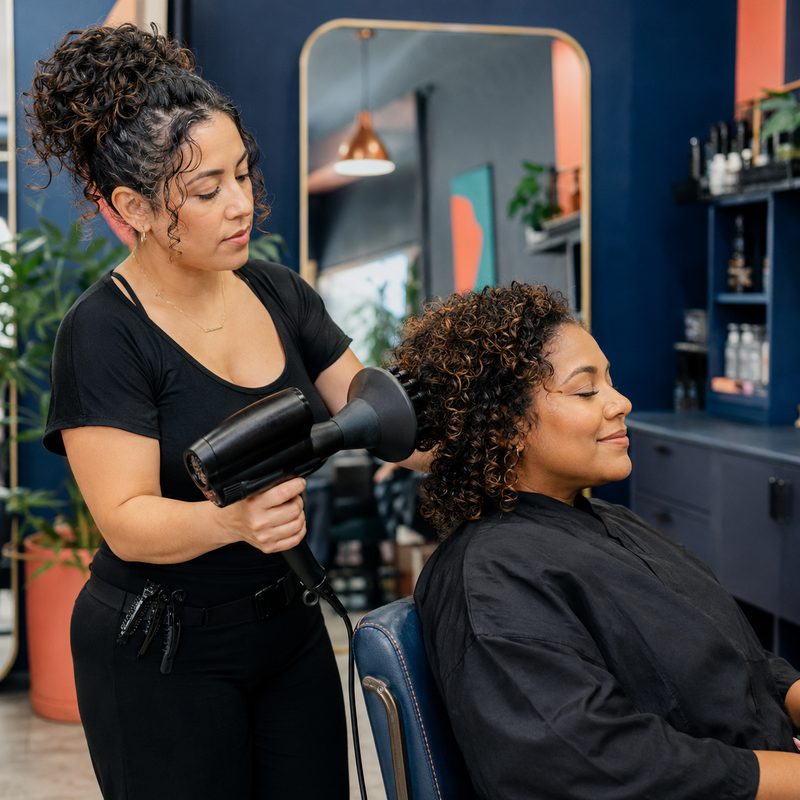 Stylist finishing a cut